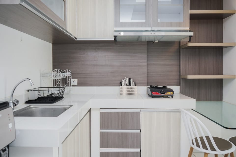 Apartment | Private kitchen | Full-size fridge, stovetop, rice cooker, dining tables