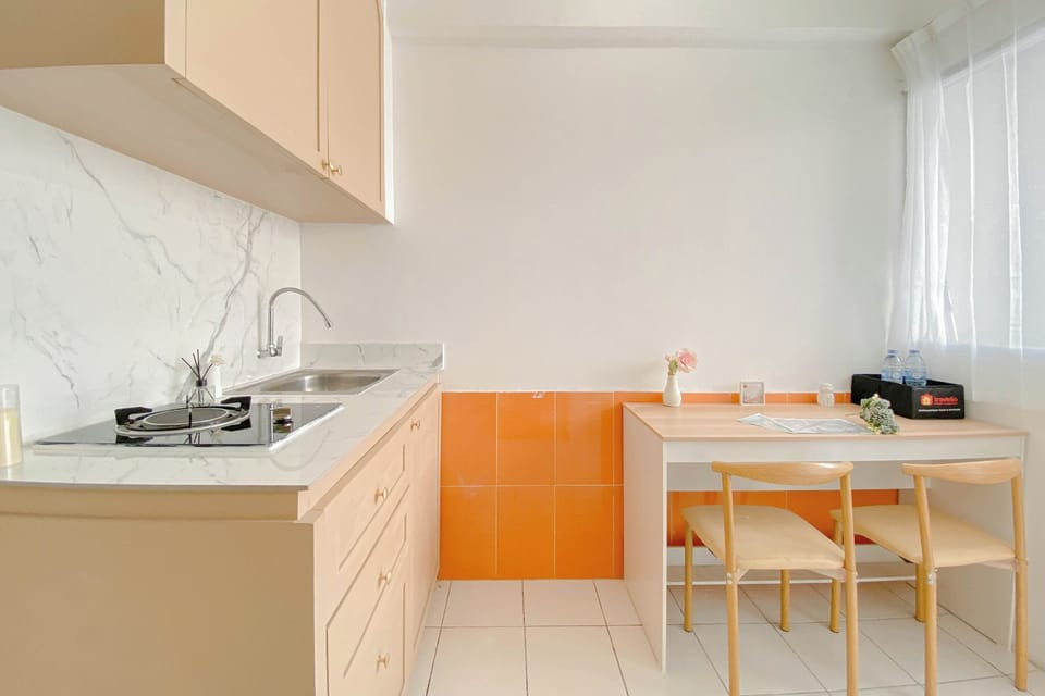 Apartment | Private kitchen | Full-size fridge, stovetop, rice cooker, dining tables