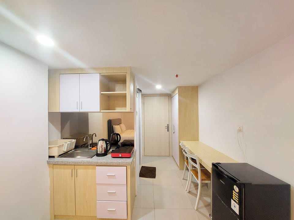 Apartment | Private kitchen | Full-size fridge, stovetop, rice cooker, dining table