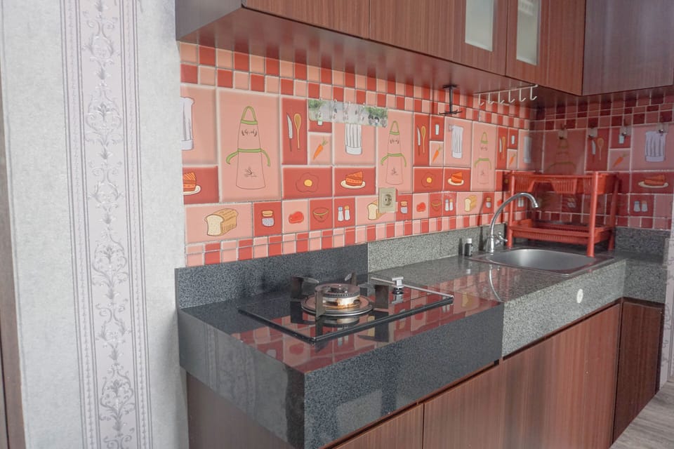 Apartment | Private kitchen | Full-size fridge, stovetop, rice cooker, dining tables