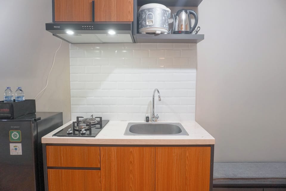 Full-size fridge, stovetop, electric kettle, rice cooker