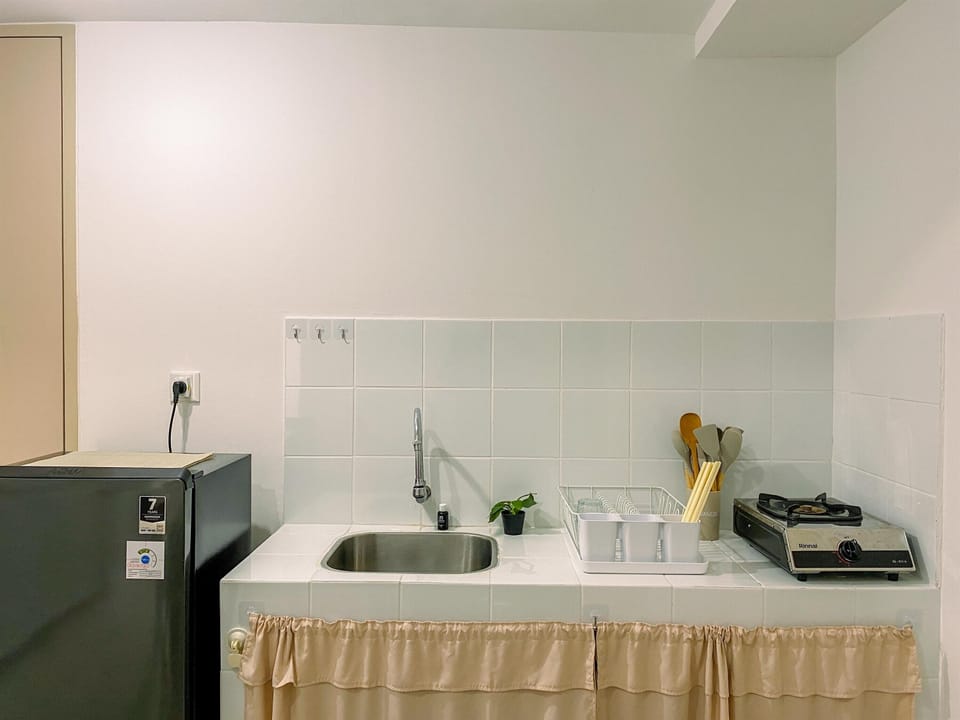 Apartment | Private kitchen | Full-size fridge, stovetop, rice cooker, dining tables