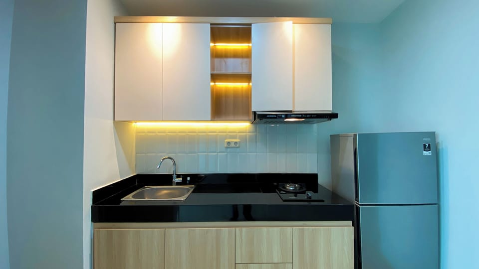 Apartment | Private kitchen | Full-size fridge, stovetop, rice cooker, dining tables