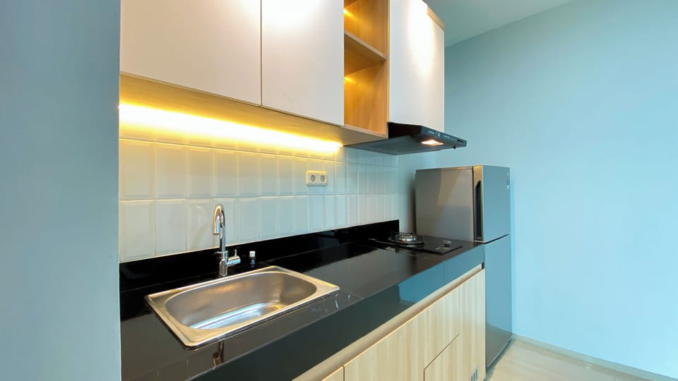 Apartment | Private kitchen | Full-size fridge, stovetop, rice cooker, dining tables