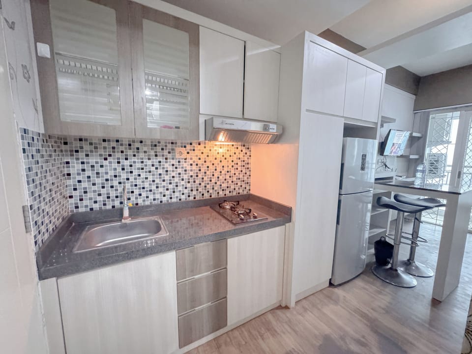 Apartment | Private kitchen | Full-size fridge, stovetop, rice cooker, dining tables
