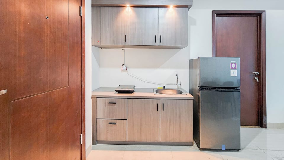 Apartment | Private kitchen | Full-size fridge, stovetop, rice cooker, dining tables