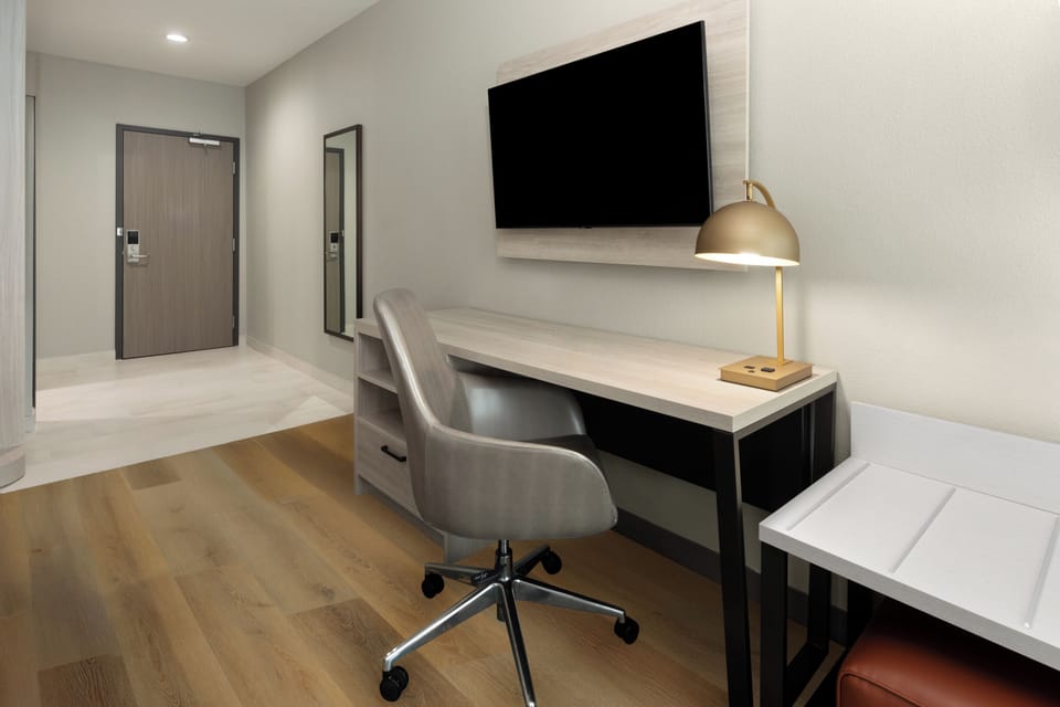 Room, 1 King Bed, Mobility Accessible, Non Smoking (Mobility, Roll-in Shower) | Desk, laptop workspace, blackout drapes, iron/ironing board