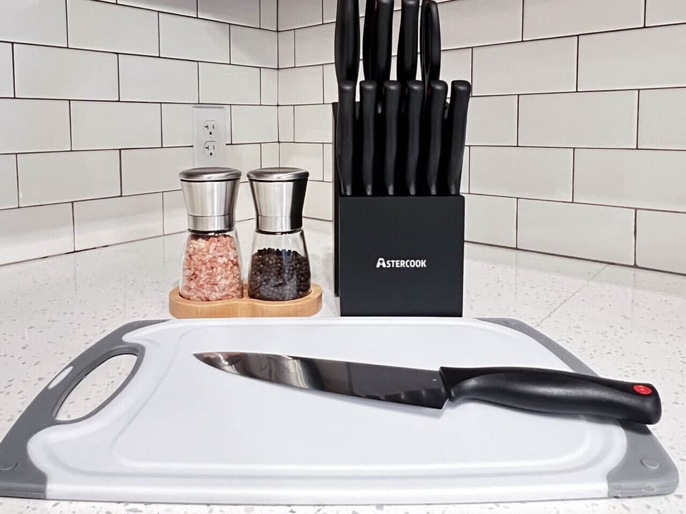 Prepare your favorite meals with ease using our well-equipped kitchen, featuring quality knives, cutting boards, and seasoning essentials for a seamless cooking experience.