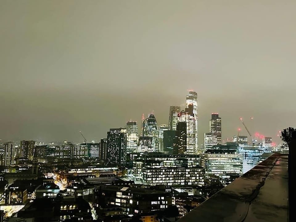 Roof terrace night view of Liverpool St 