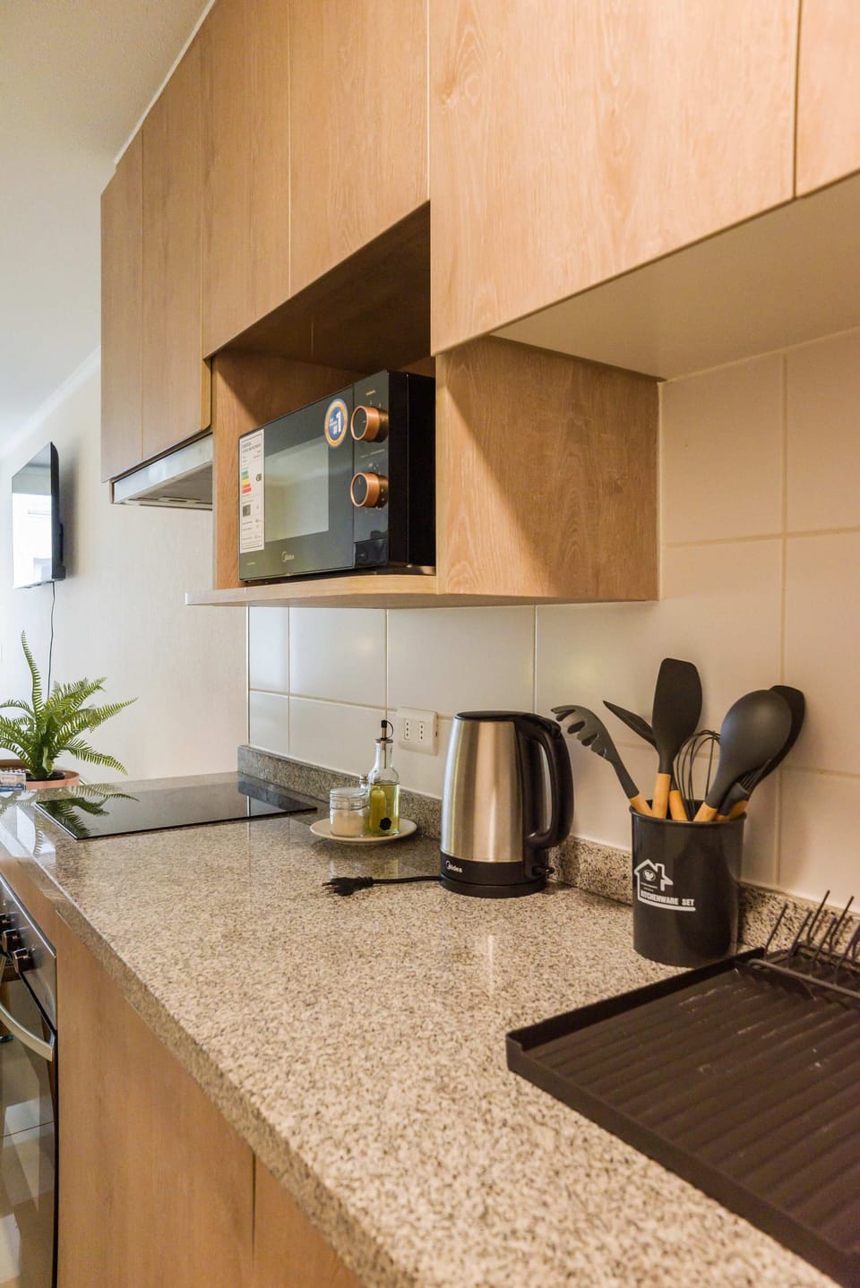 Modern kitchen with sleek appliances and ample counter space, perfect for preparing meals during your stay.