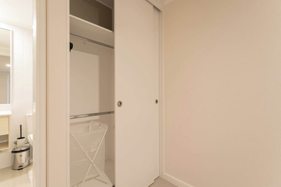 Convenient closet space with easy bathroom access for a seamless stay.