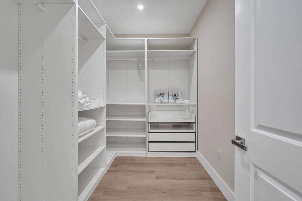 Settle in with ease and enjoy ample storage space, featuring a spacious closet with shelving and hangers for a comfortable extended stay.