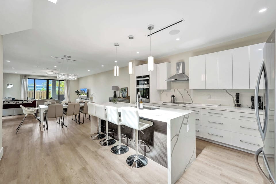 Gather, relax, and feel at home in this stylish open-concept space featuring a fully equipped kitchen, inviting dining area, and cozy living room designed for comfort and connection.