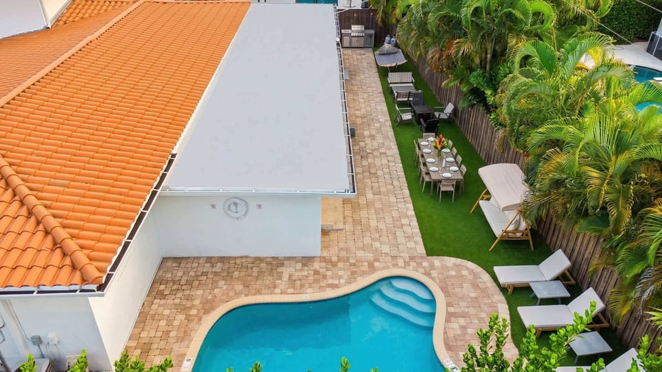 Dive into relaxation by the sparkling pool and lush tropical gardens!