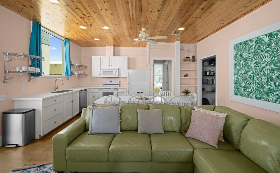 Kitchen to Dining — White Cabinets, Chrome Shelves, Built-In Shelving & Tropical Palm Art