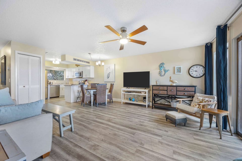 Bright living area with sofa sleeper, and Smart TV