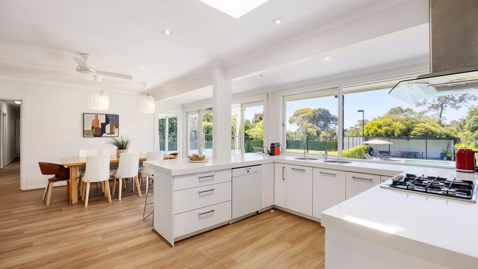 Spacious kitchen with adjacent dining area