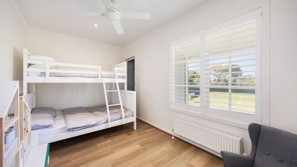 Bedroom four with double bunk and single above 