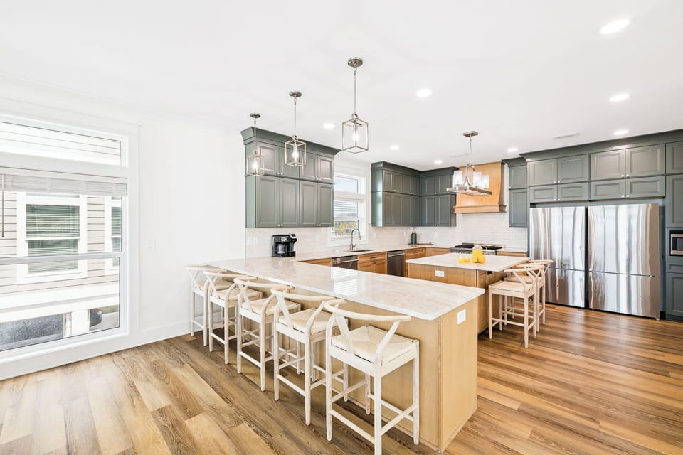 Your gourmet kitchen awaits with modern appliances, spacious countertops, and cozy breakfast bar seating—perfect for gathering with loved ones over morning coffee or preparing memorable meals together.