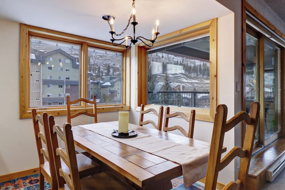 Dining room area features large windows allowing ample natural light to come in.
