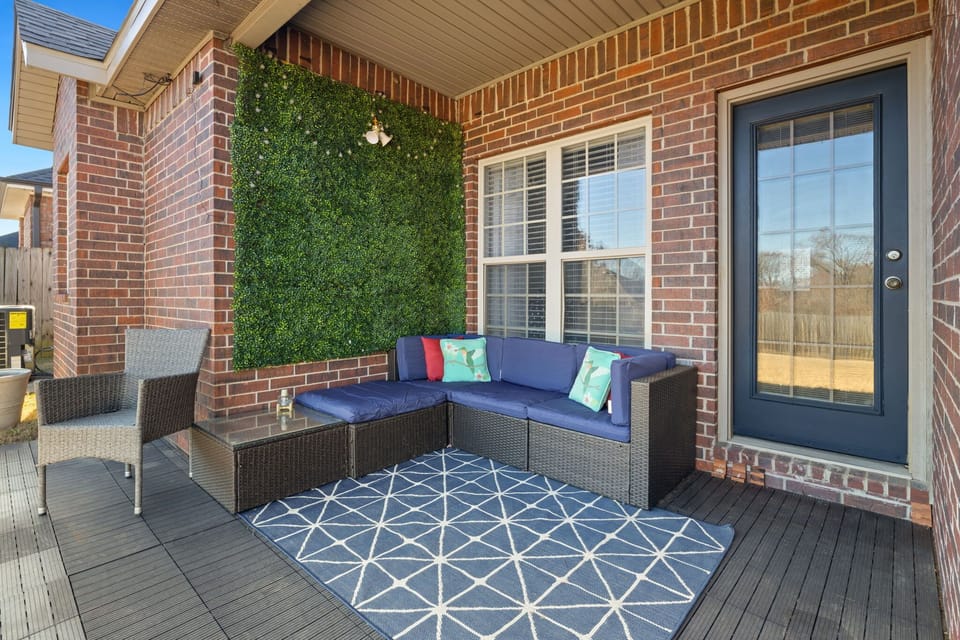 Spend time outside in the private fully fenced in back yard with lounge seating.