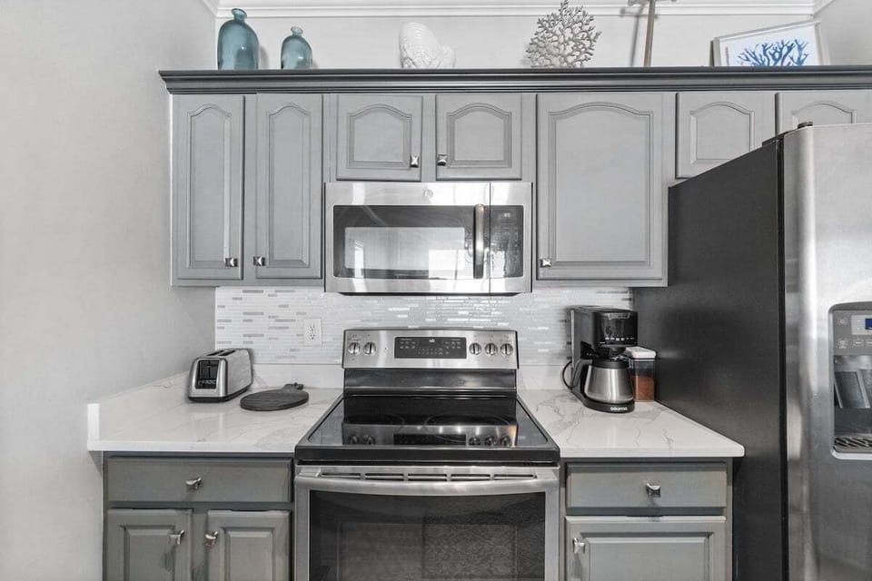 The kitchen is fully stocked with cooking essentials, making meal prep easy and convenient.