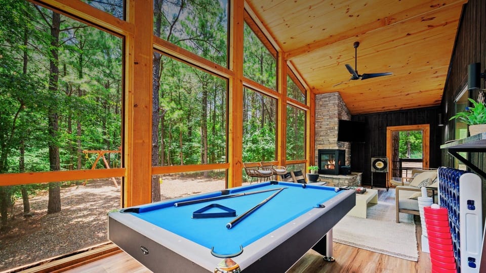 Play pool (the table also converts into a ping pong table) in the screened in porch