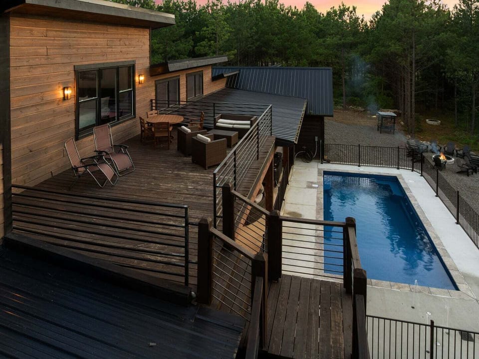 Gated heated swimming pool overlooking the pond