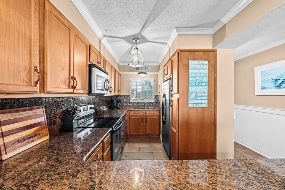 Kitchen is spacious with all your cooking and prep needs