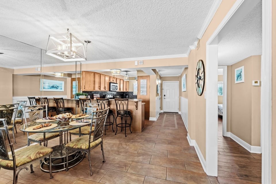 Dining area with kitchen and entryway
