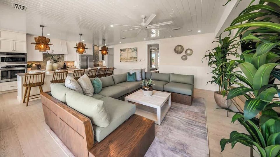 Great Room - Open Floor Plan - Fully Stocked Kitchen, Dining for 8 and Bar seating for 5 - Balcony Access