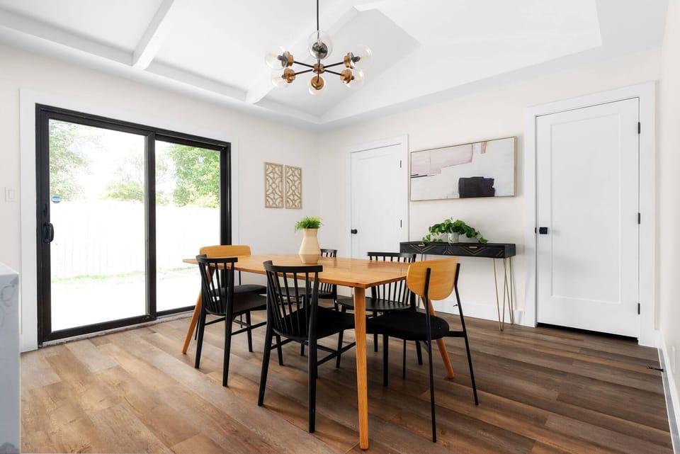 Bright dining area with modern design and natural light — the perfect spot for shared meals, morning coffee, or dinner with friends