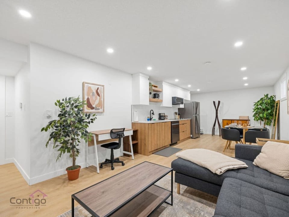 Space has you covered with a cozy living room and a functional workspace.