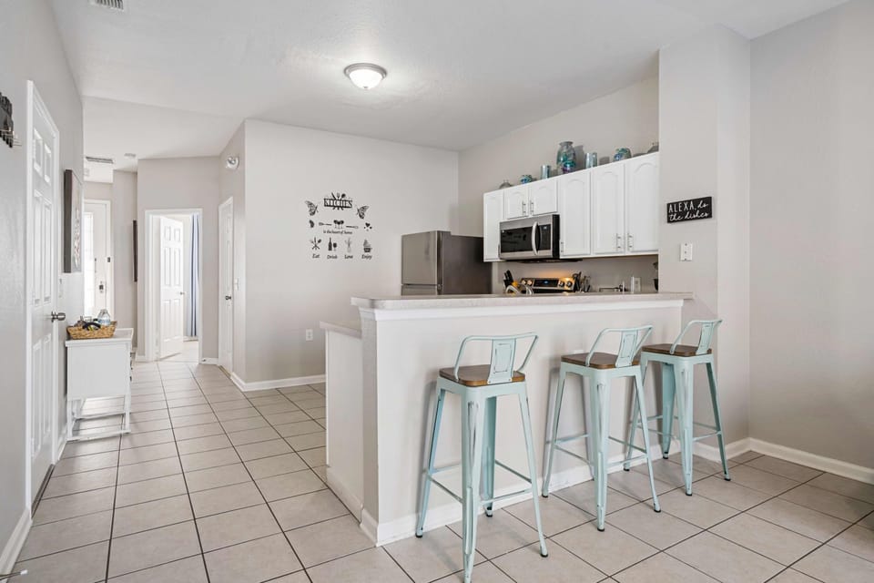 Family kitchen with breakfast bar seating. 