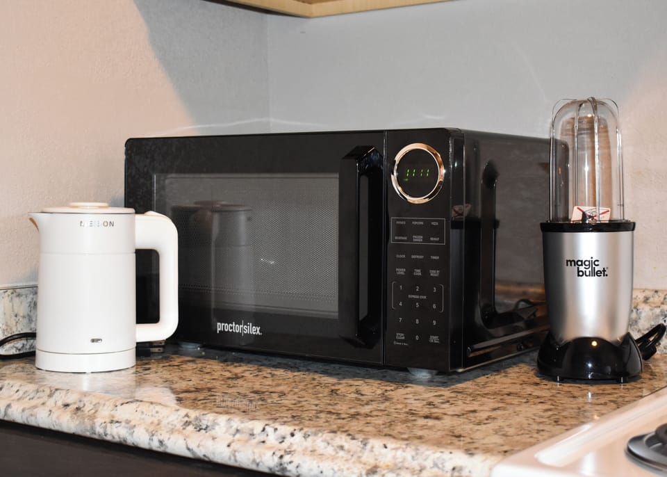 Microwave, hot water kettle, and blender 