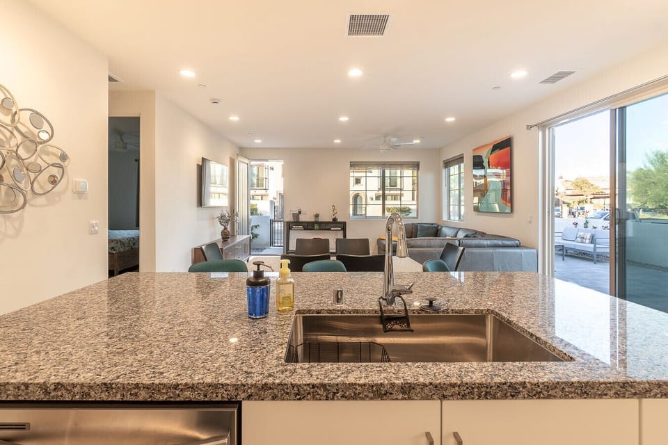Spacious kitchen view overlooking the living area and patio access.