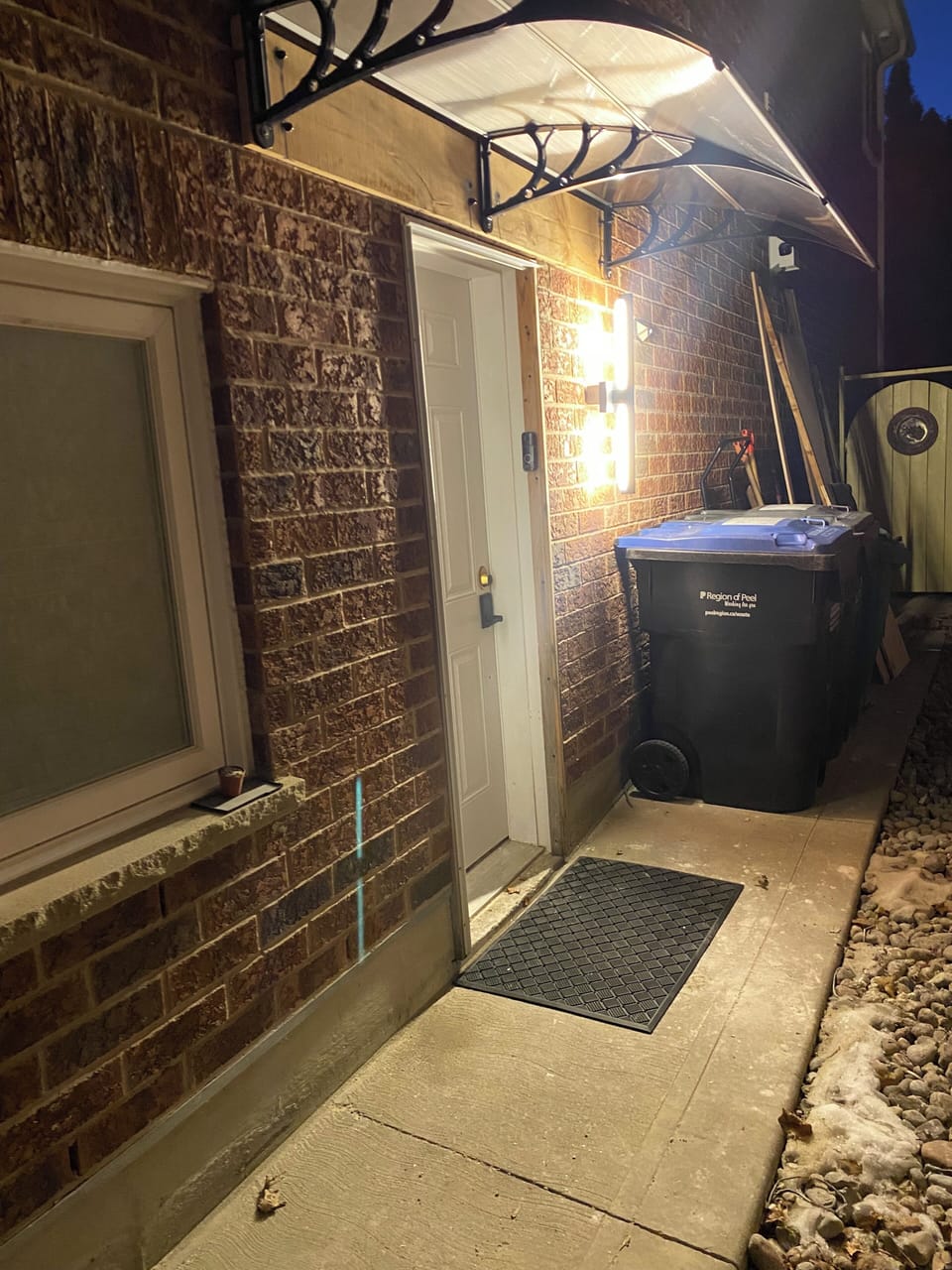 Entrance view at night time. With smart access code.