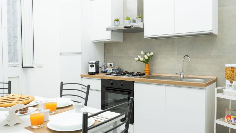 Family Room, Garden View | Private kitchen | Full-size fridge, oven, stovetop, espresso maker