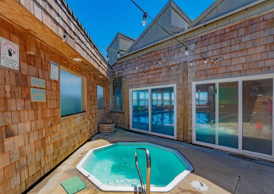 Unwind in the secluded outdoor hot tub, surrounded by rustic charm and fresh mountain air.