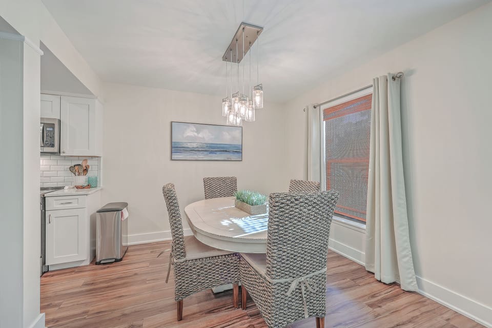 Enjoy family dinners around the bright dining table, perfectly situated right off the gorgeous, newly updated kitchen.