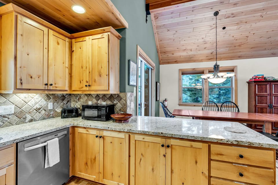 Kitchen: Main floor, drip coffee maker, Keurig, toaster, cooking utensils, tableware
