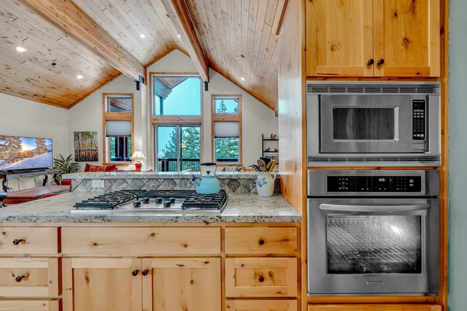 Kitchen: Main floor, drip coffee maker, Keurig, toaster, cooking utensils, tableware
