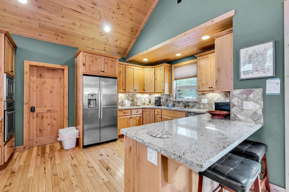 Kitchen: Main floor, drip coffee maker, Keurig, toaster, cooking utensils, tableware
