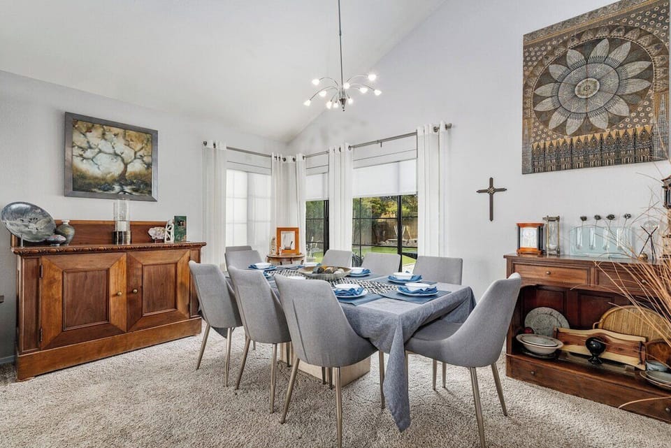 Spacious dining table with seating for eight, perfect for family meals.