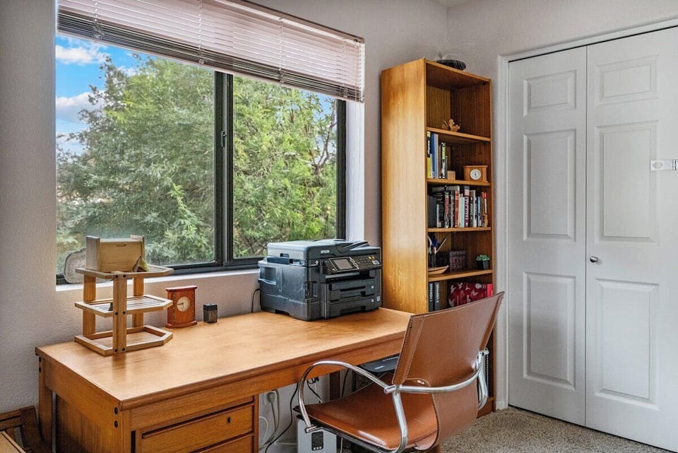 The primary suite has a desk, equipped with a printer for those pesky work to-do's while you're away.