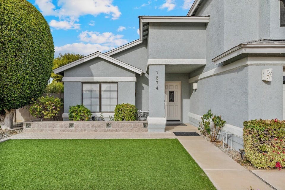 Lush landscaping welcomes you to the front door.