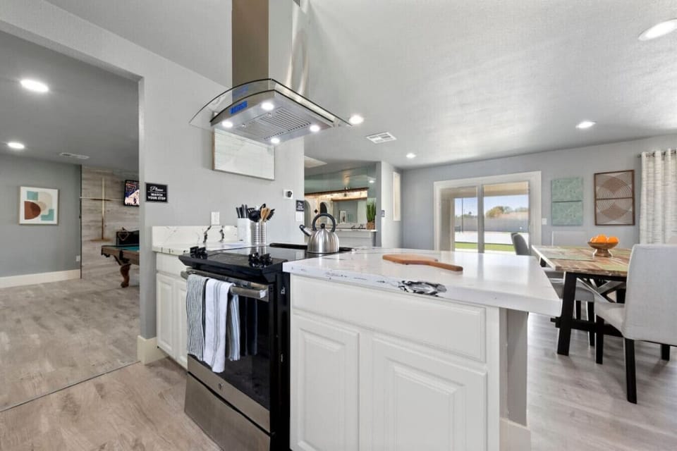 Step into this sleek kitchen, where every corner invites you to cook, relax, and indulge.`