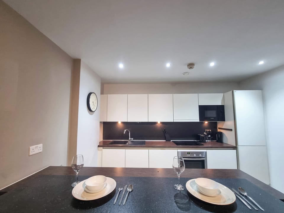 Gather around the spacious breakfast island, the perfect spot for casual meals, coffee, or socializing while you cook.