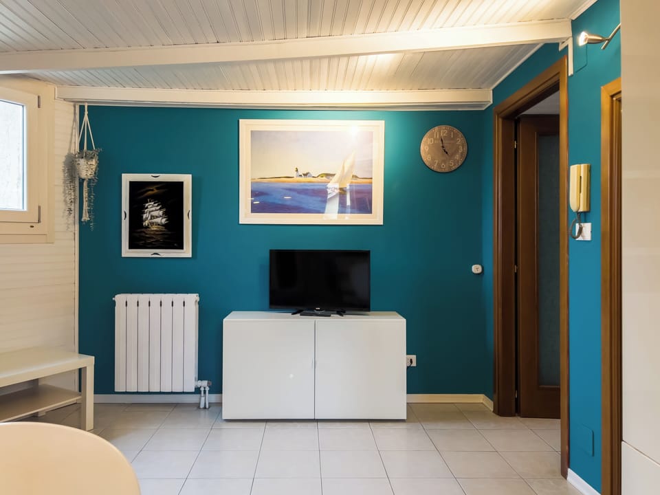 Apartment, Balcony | Living area | 35-inch TV with digital channels