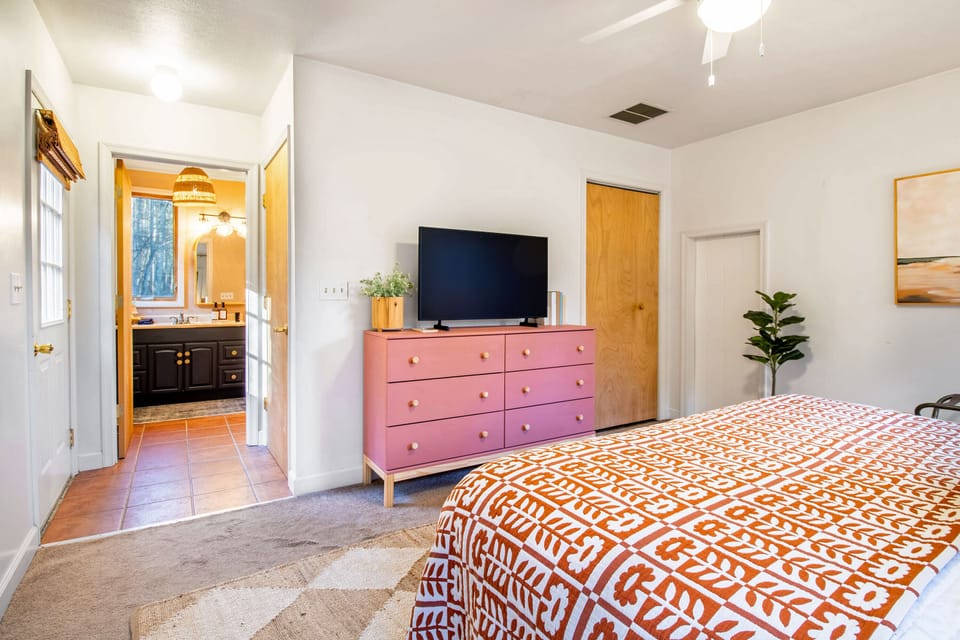 Bedroom 1 includes one king bed, tv, private full bathroom, and outdoor access